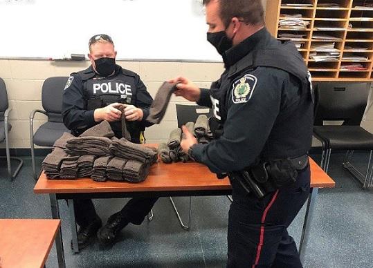 NIAGARA REGIONAL POLICE HANDING OUT WINTER CARE BUNDLES TO THOSE IN NEED